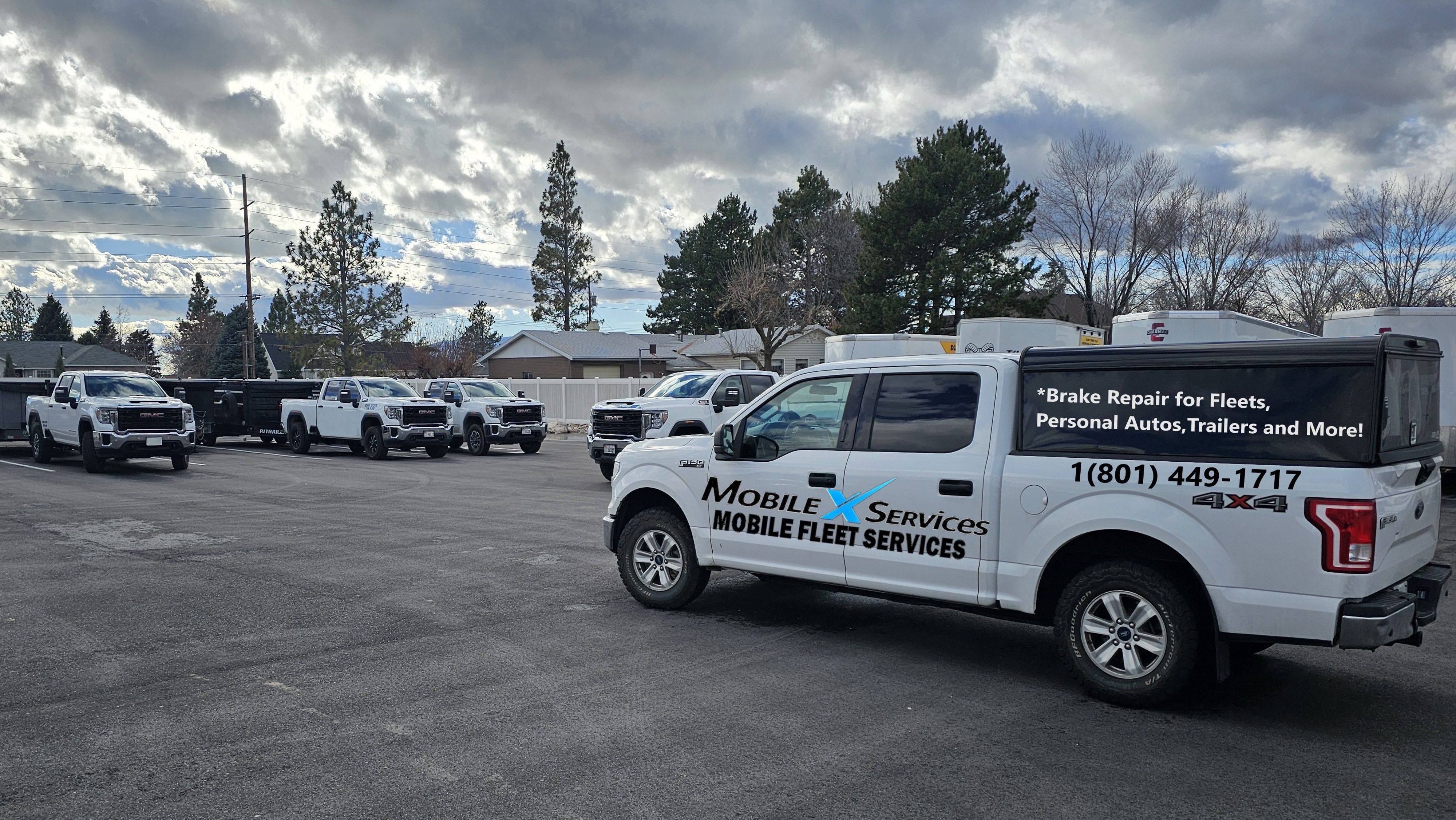 MobileXServices branded truck with fleet of pickup trucks — mobile fleet repair in Utah